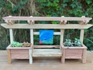 A hand made Double Planter Cedar Wood Trellis with the option to hang and object.